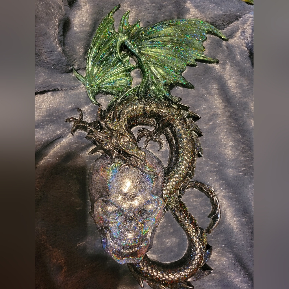 Unique resin dragon and skull wall hanging.